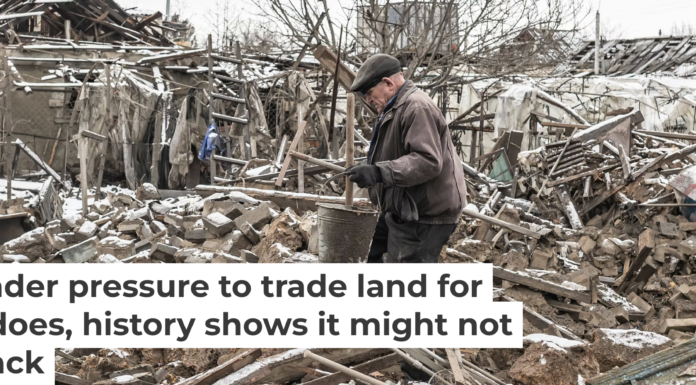 An elderly Ukrainian walks through the rubble following a Russian aerial bomb strike in Donetsk Oblast. Diego Herrera Carcedo/Anadolu via Getty Images